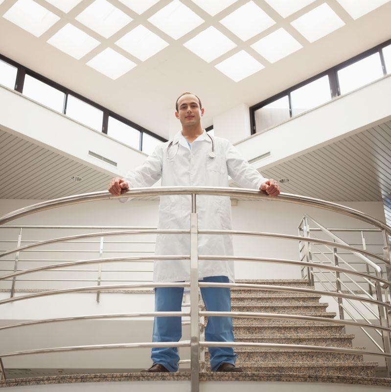 Doctor looking down from stairwell