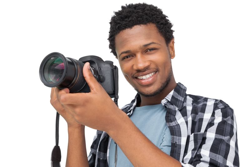 Portrait of a happy male photographer