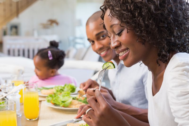 Happy family enjoying a healthy meal together 