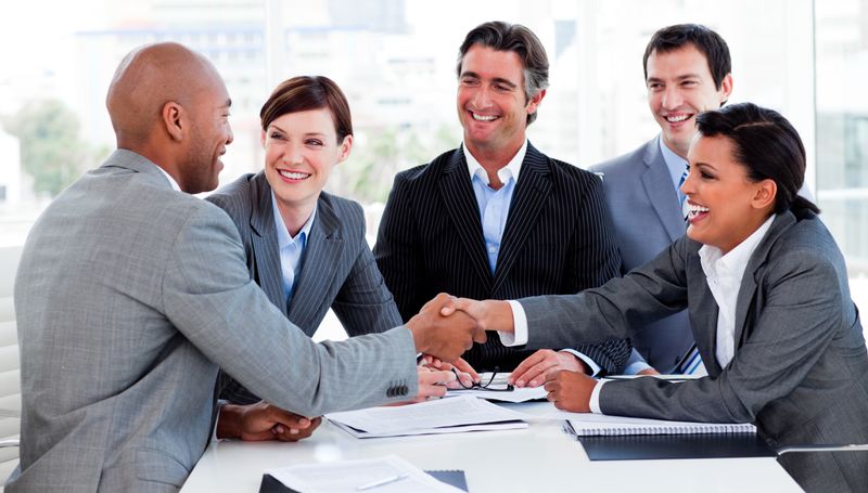 Business people greeting each other in a meeting