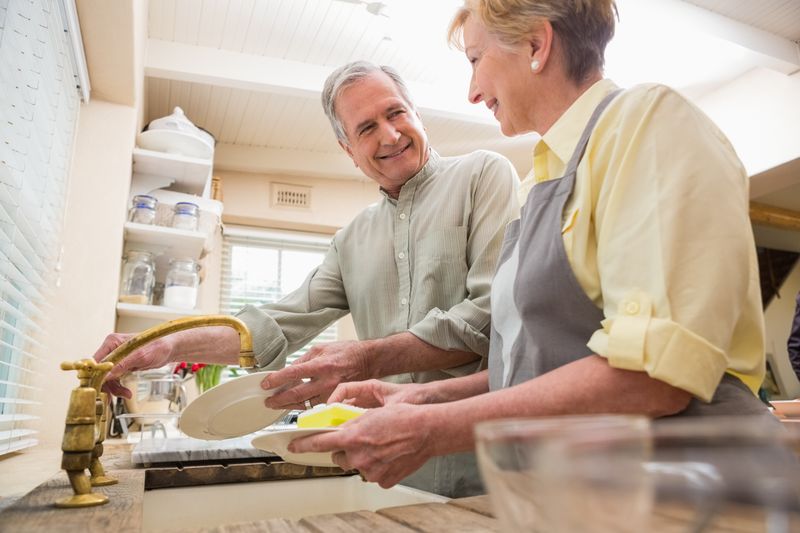 Senior couple washing the dishes