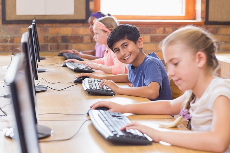 Cute pupils in computer class 