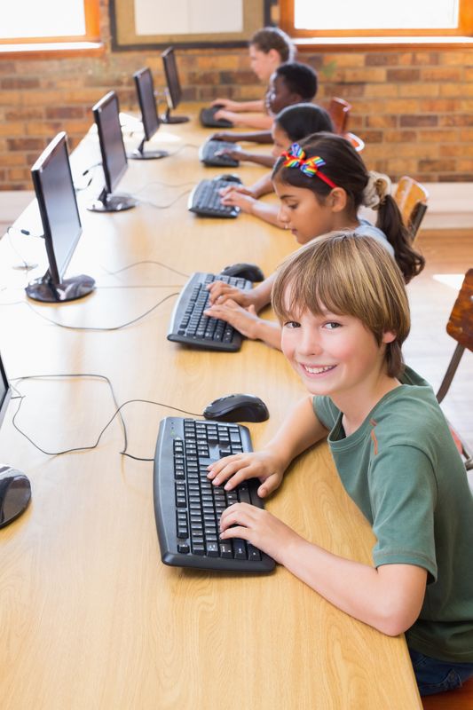 Cute pupils in computer class