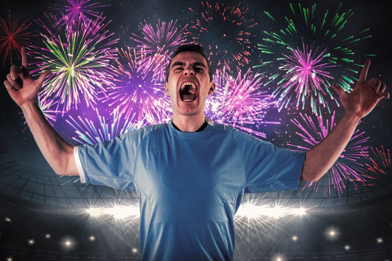 Composite image of rugby player gesturing fingers crossed