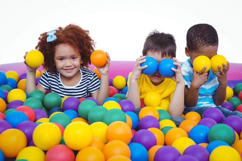 Cute smiling kids in sponge ball pool