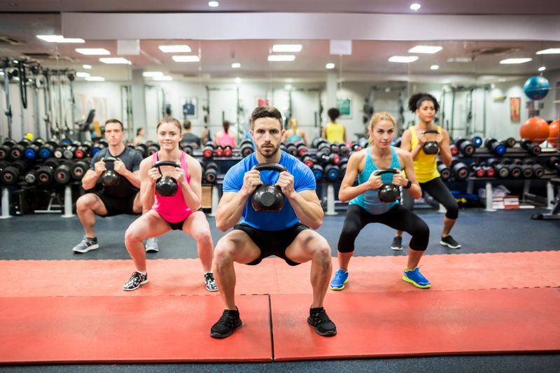 Fit people working out in fitness class at the gym