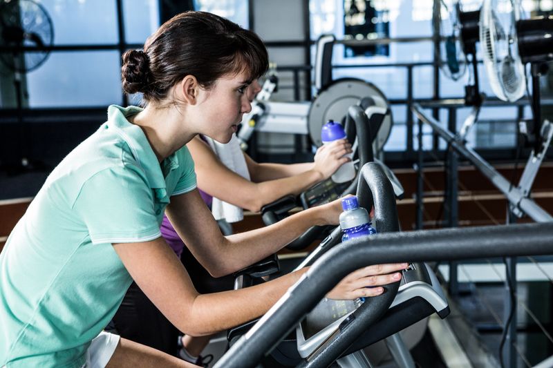 Fit women using bike