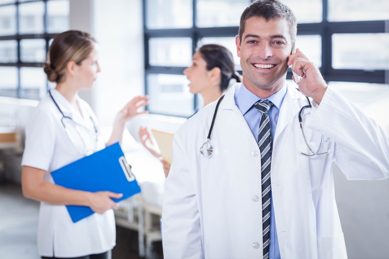 Happy doctor on the phone