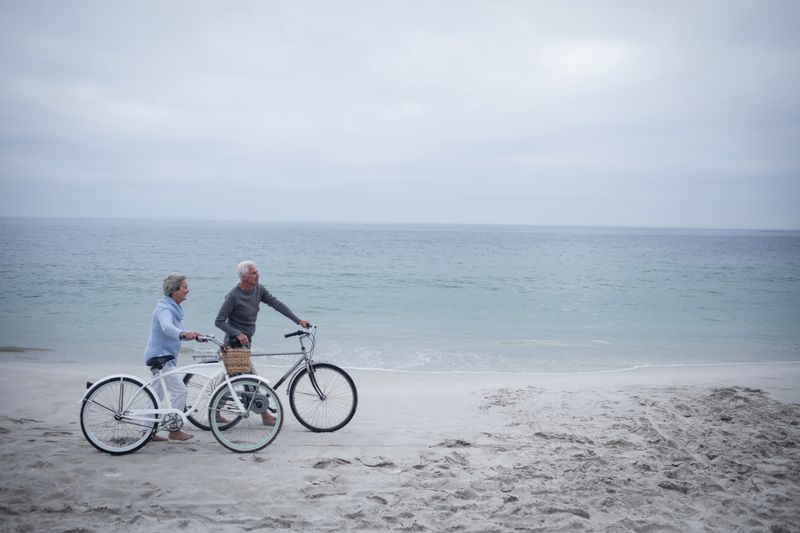 Senior couple having ride with their bike