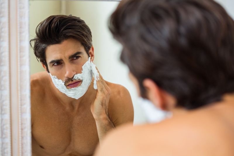 Man applying shaving foam