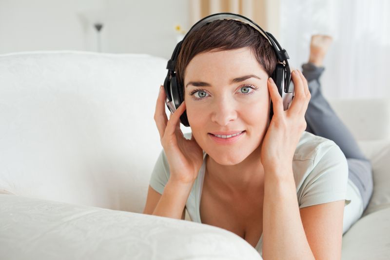 Shorthaired brunette listening to music