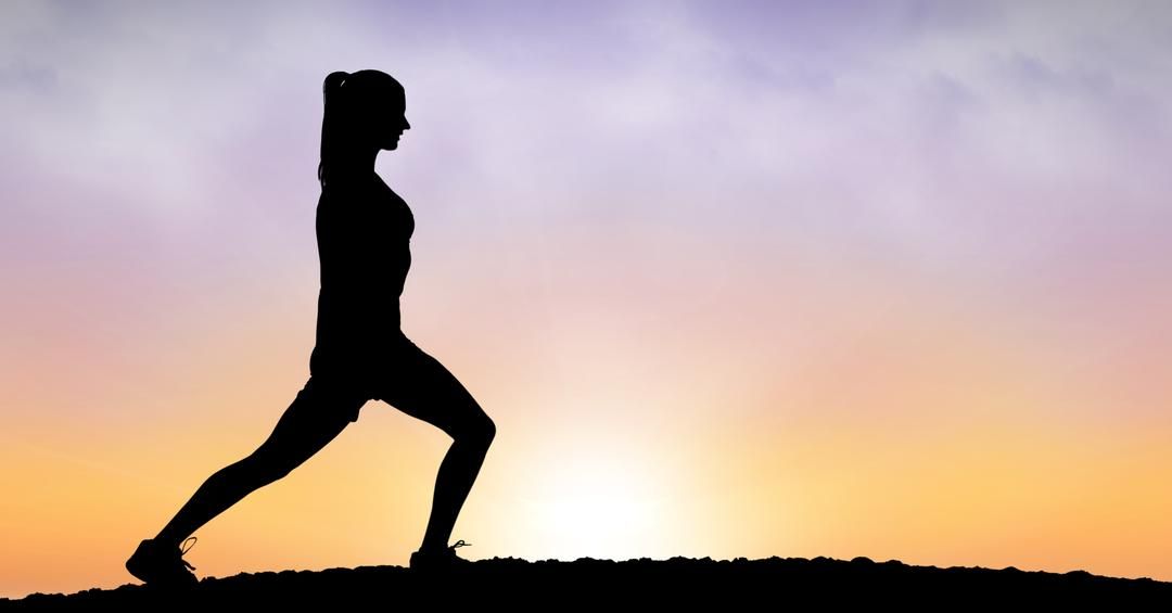 Image of a silhouette of a woman stretching at sunset - Meaning and use of hero image in web design - Image