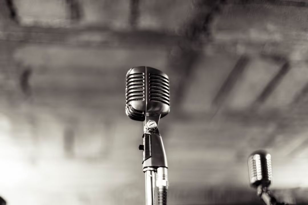 Monochrome image of a microphone - Tips on how to build a successful marketing podcast - Image