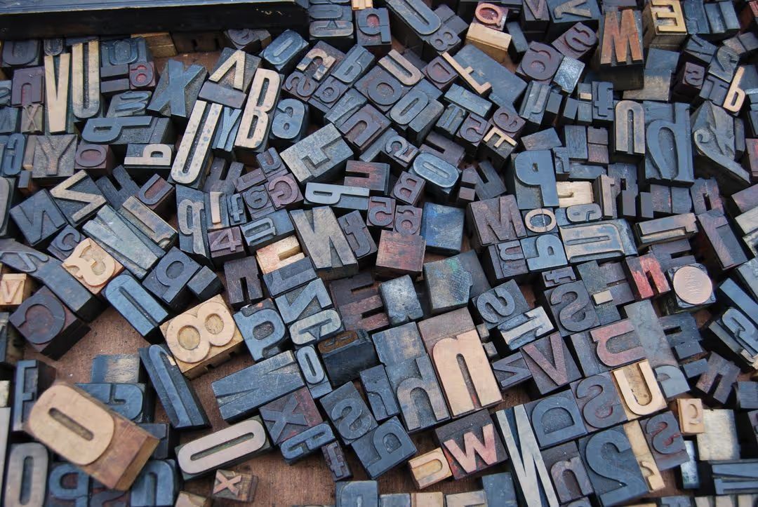 Overhead image of multi-colored blocks of letters and numbers - Design Wizard will help you make your social media posts unique - Image