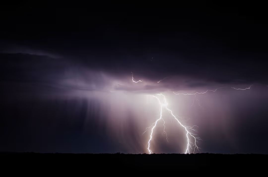 Image of the sky at night while lightning strikes - A selection of great images for virtual Zoom backgrounds from the PikWizard team - Image