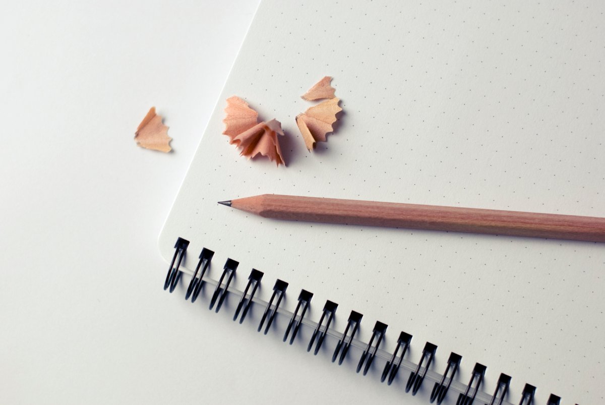 Image of a sharpened pencil on a notebook - A beginner's guide to royalty-free content - Image