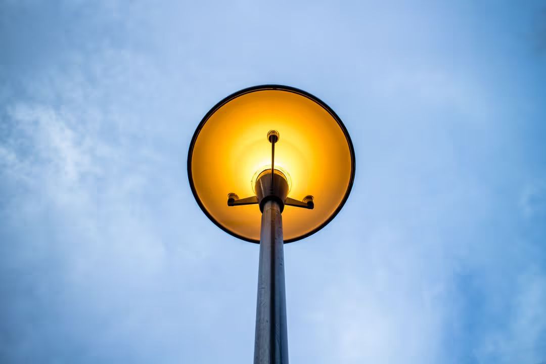 Edited image of a yellow light street lamp with a sky blue background - How to choose a good color combination for photography - Image