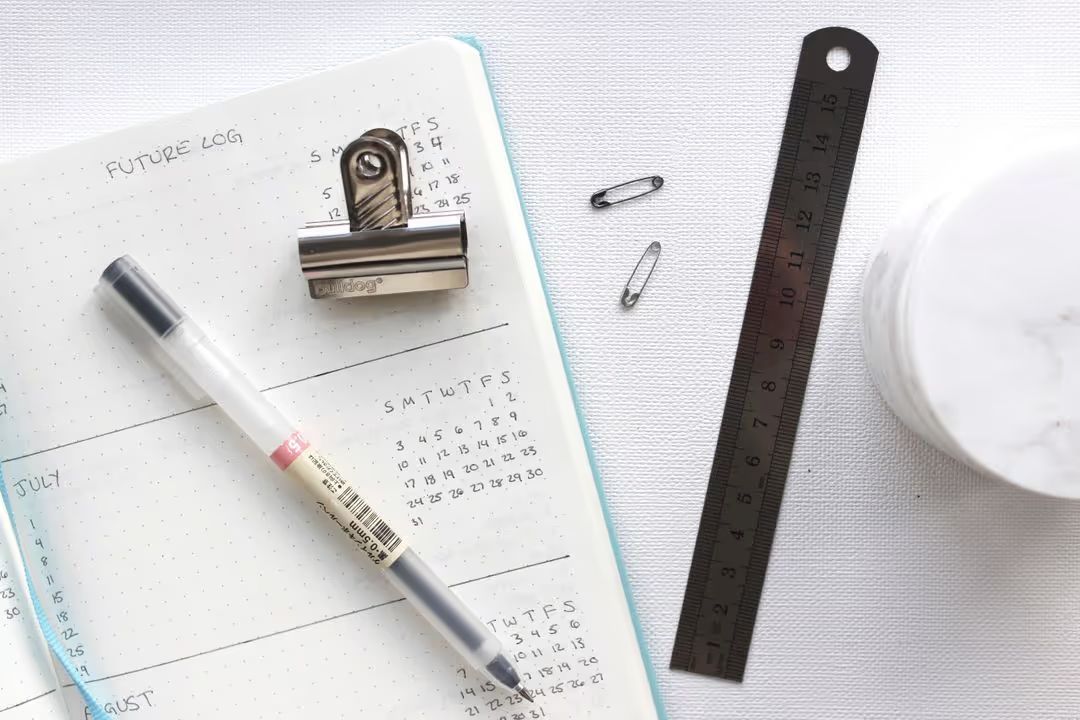 Image of planner and pen - How to keep your audience engaged on social media - Image