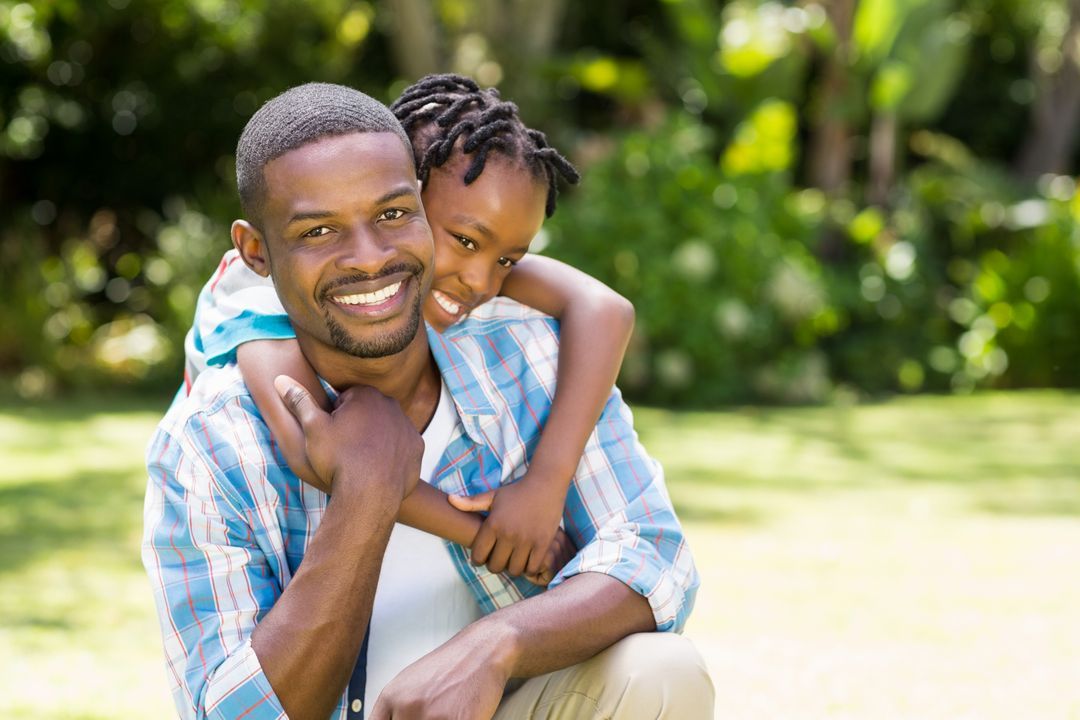 Image of a little boy hugging a man who is sitting on the ground from behind - Ten powerful advertising techniques to lure customers and boost your sales - Image