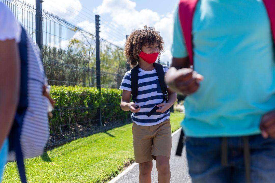 Image of a little boy with a face mask on his way to school - Ten powerful advertising techniques to lure customers and boost your sales - Image