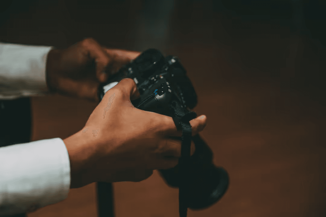 Image of a man holding a camera - Copyright laws in the US and EU - Image
