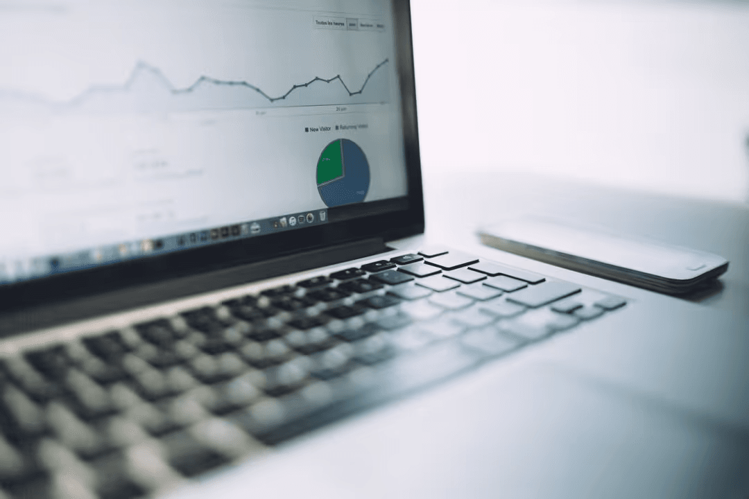 Image of a laptop with analyses on the screen - Why it is important to monitor every step of your marketing efforts - Image