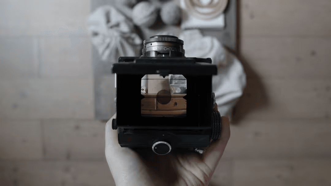 Image of a camera taking a picture of a product on a wooden surface - Retail marketing strategy tips and tricks to drive sales and save money - Image