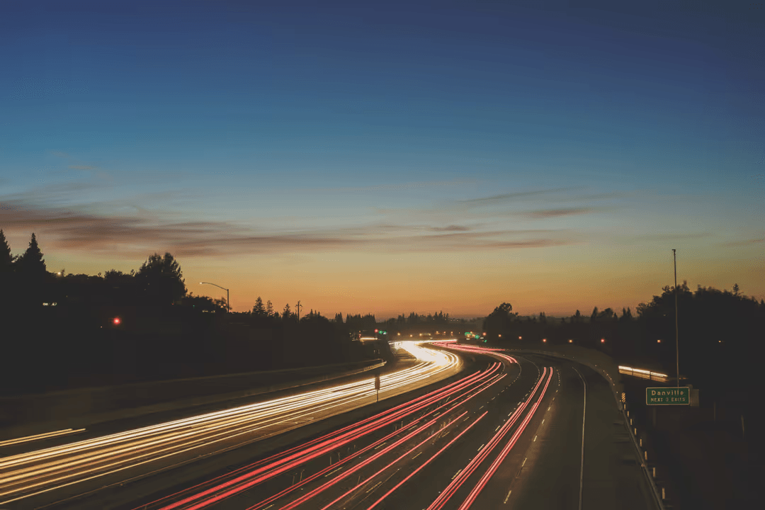 A road at night with lights from moving cars - Retail marketing strategy tips and tricks to drive sales and save money - Image
