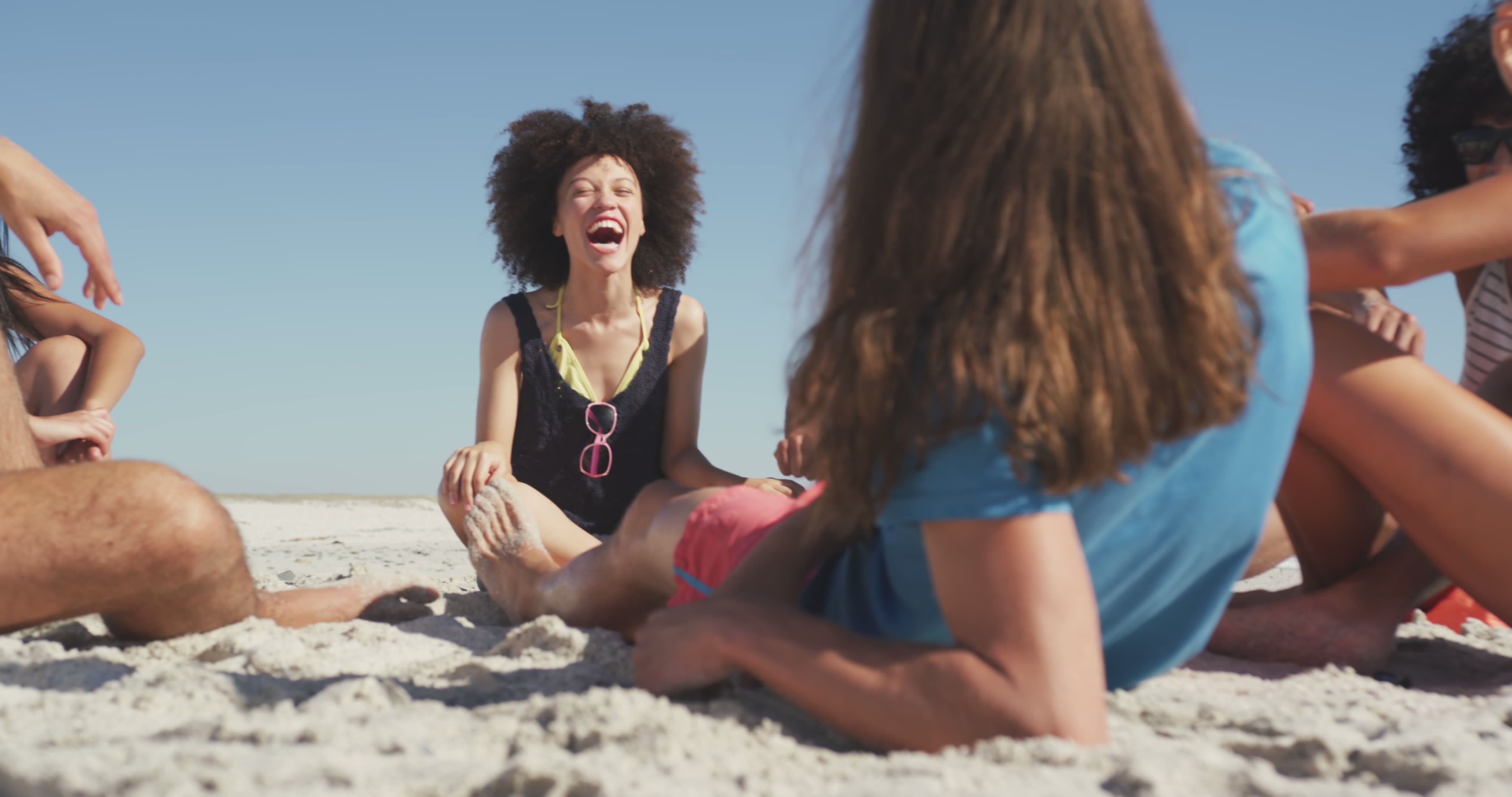 Friends laughing at the summer beach