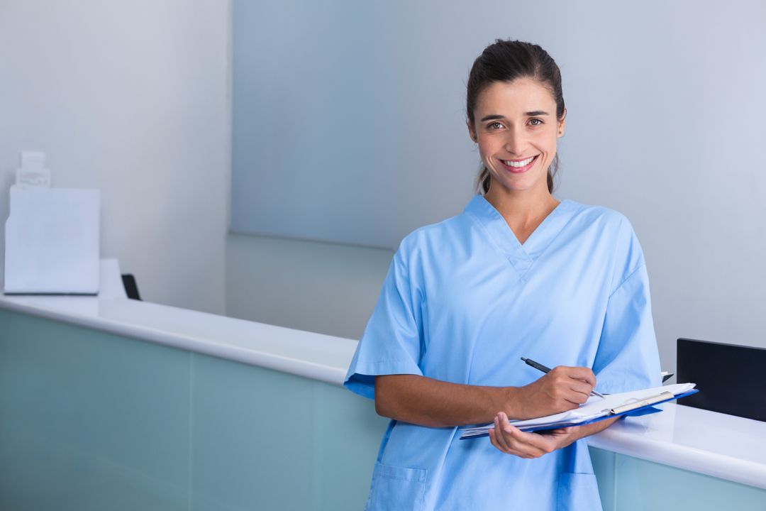 Compassionate Female Nurse Documenting Patient Care in Modern Medical Facility