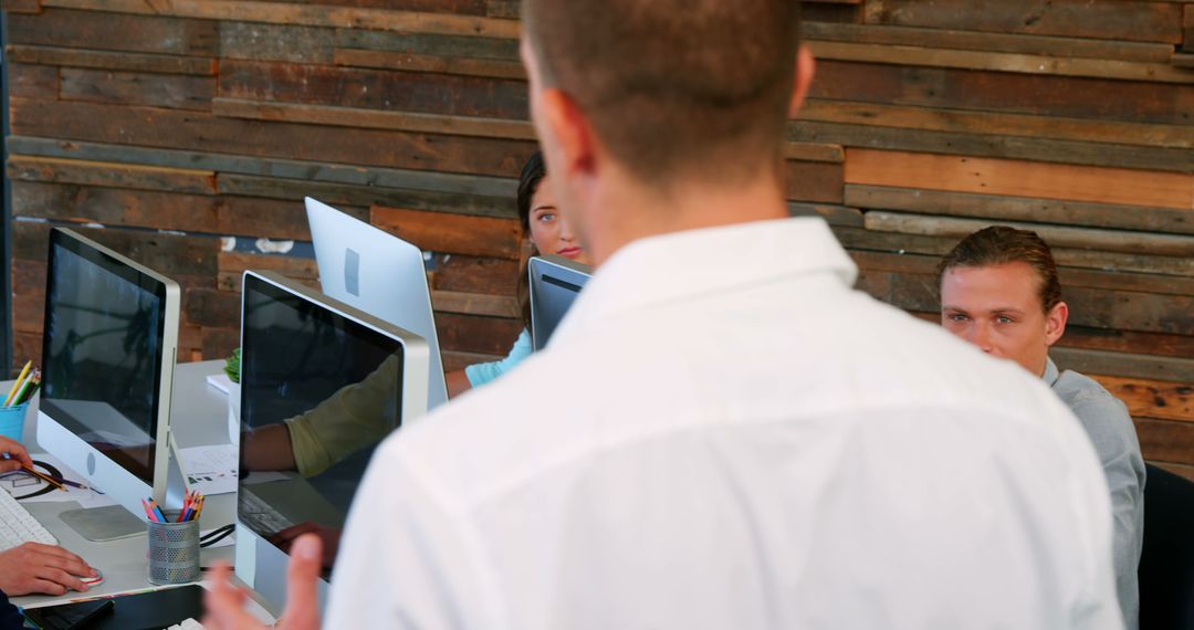 Business Team Engaged in Office Discussion