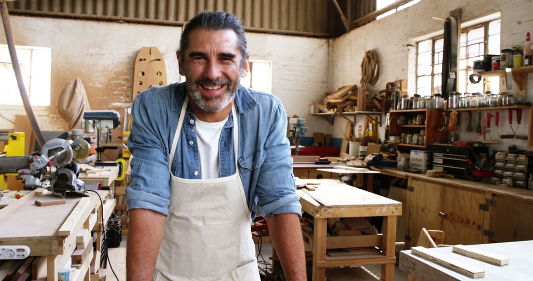 Smiling Mature Carpenter in Woodworking Workshop - Free Images, Stock Photos and Pictures on Pikwizard.com