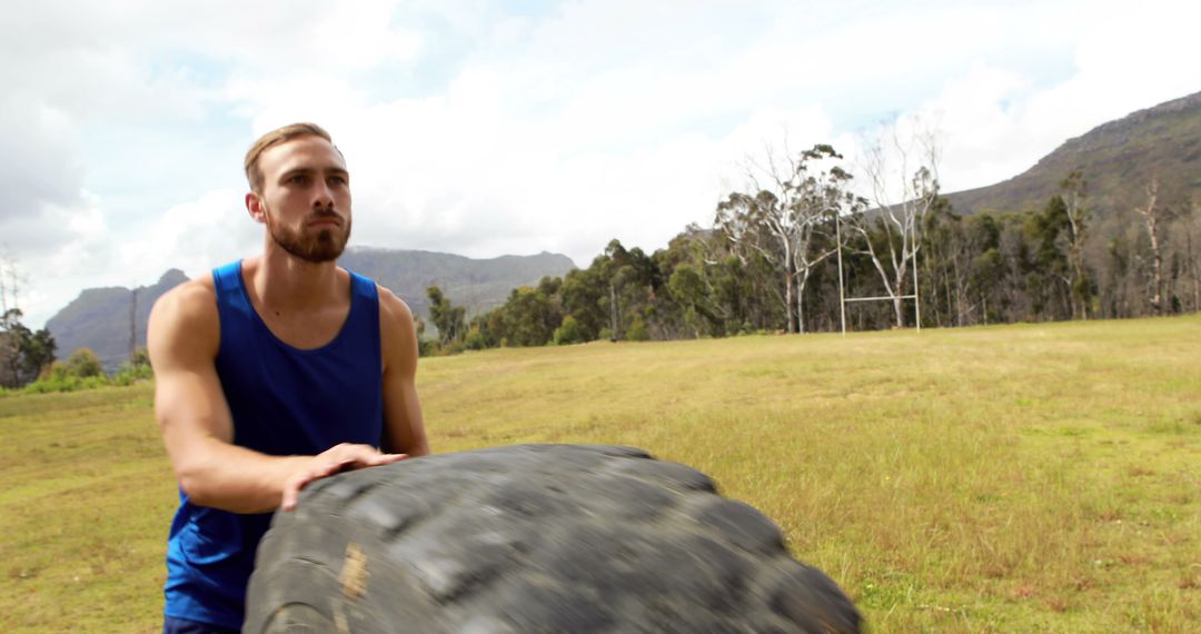 Man Flipping Tractor Tire in Outdoor Fitness Training - Free Images, Stock Photos and Pictures on Pikwizard.com