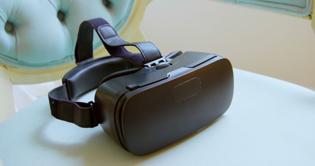 Virtual Reality Headset Resting on Armchair at Home - Free Images, Stock Photos and Pictures on Pikwizard.com