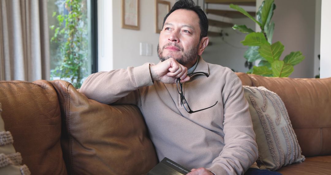 Mature Man Deep in Thought While Reflecting at Home