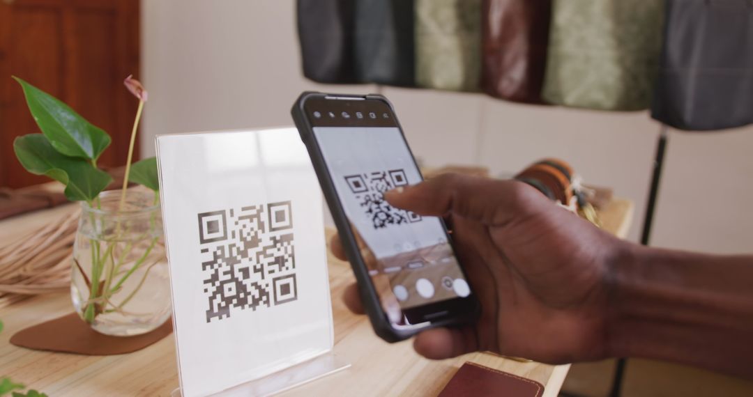 Craftsman Scanning QR Code in Modern Leather Workshop