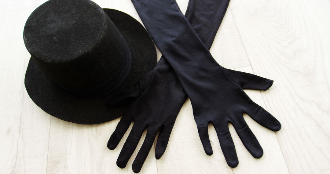 Black Top Hat and Long Gloves on Wooden Surface - Free Images, Stock Photos and Pictures on Pikwizard.com