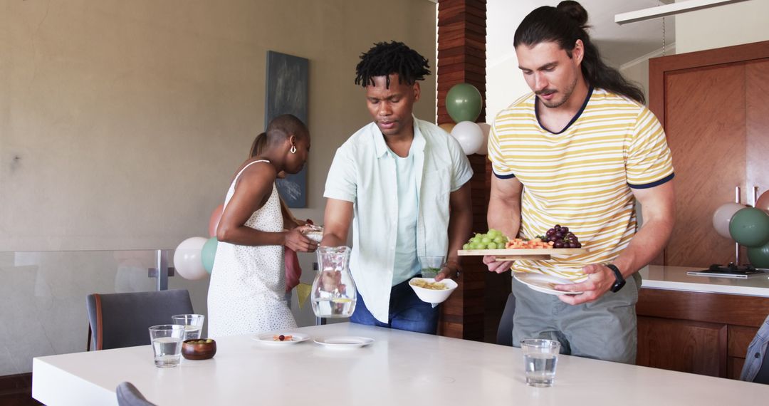 Young Friends Preparing Meal at Dining Table Gathering
