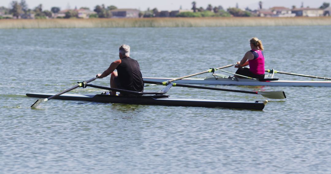 Two Rowers Practicing on Calm Lake Waters - Free Images, Stock Photos and Pictures on Pikwizard.com