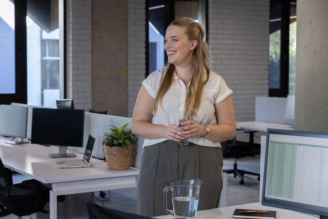 Woman Enjoying Break in Modern Open Office Workspace
