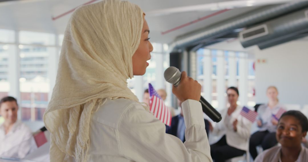 Woman in Hijab Speaking at Political Convention with Engaged Audience - Free Images, Stock Photos and Pictures on Pikwizard.com