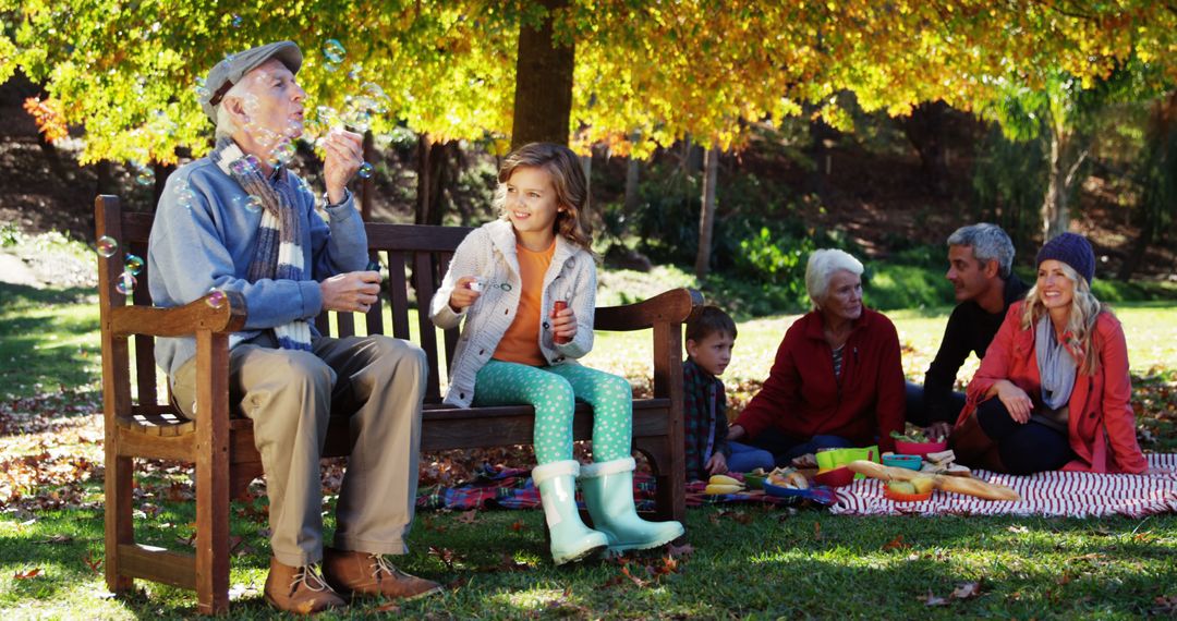 Multigenerational Family Enjoying Fall Picnic in Park - Free Images, Stock Photos and Pictures on Pikwizard.com