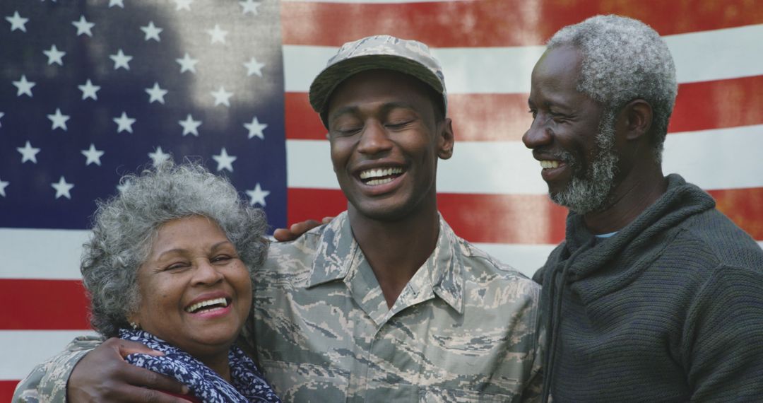 Happy Military Family in Front of American Flag - Free Images, Stock Photos and Pictures on Pikwizard.com