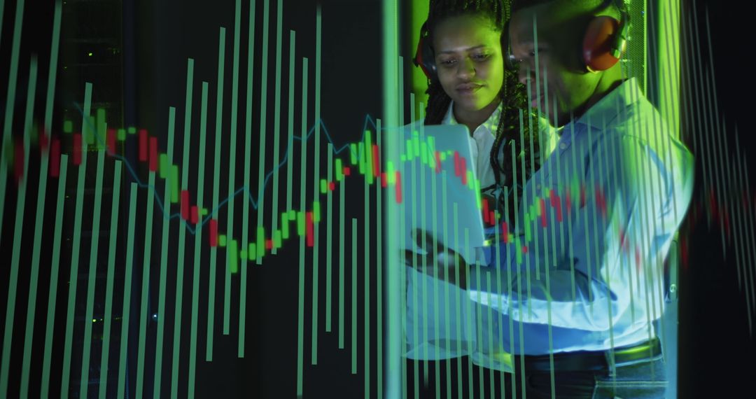 IT Engineers Analyzing Tech Data in Server Room