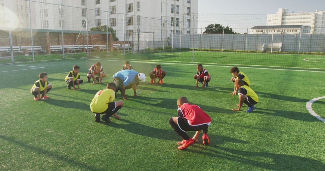 Youth Soccer Team Stretching on Outdoor Field - Free Images, Stock Photos and Pictures on Pikwizard.com