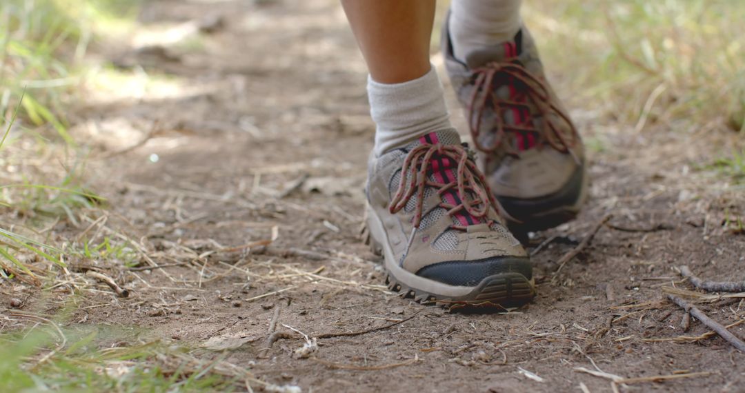 Environmental Cleanup on Trail: Person Collecting Litter While Walking