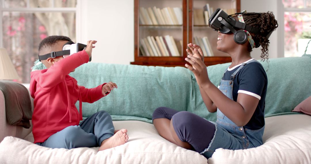 Kids Enjoying Virtual Reality Game Together on Couch - Free Images, Stock Photos and Pictures on Pikwizard.com