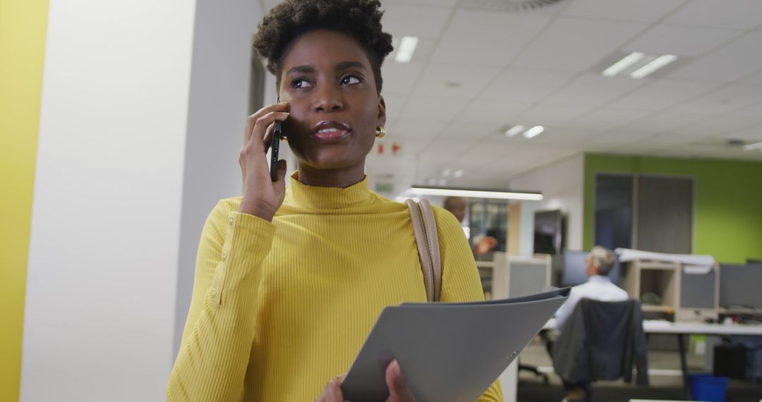 Confident African American Businesswoman Talking on Phone in Office - Free Images, Stock Photos and Pictures on Pikwizard.com