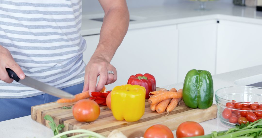 Person Chopping Vegetables on Clean Kitchen Counter - Free Images, Stock Photos and Pictures on Pikwizard.com