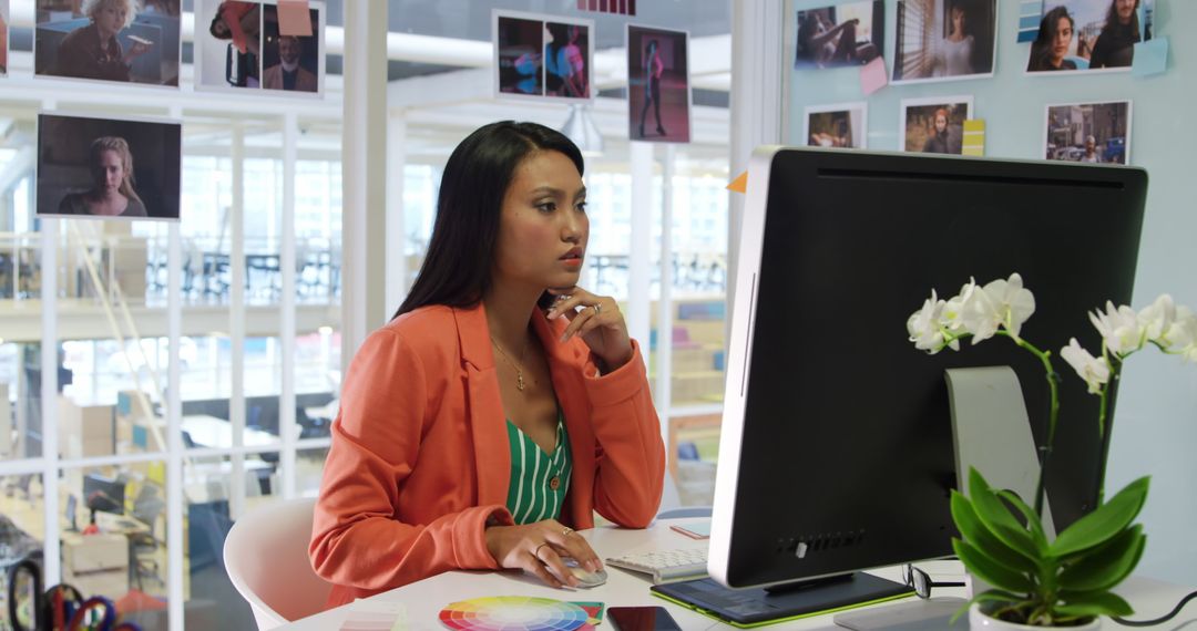 Creative Professional Analyzing Color Palettes in Modern Office